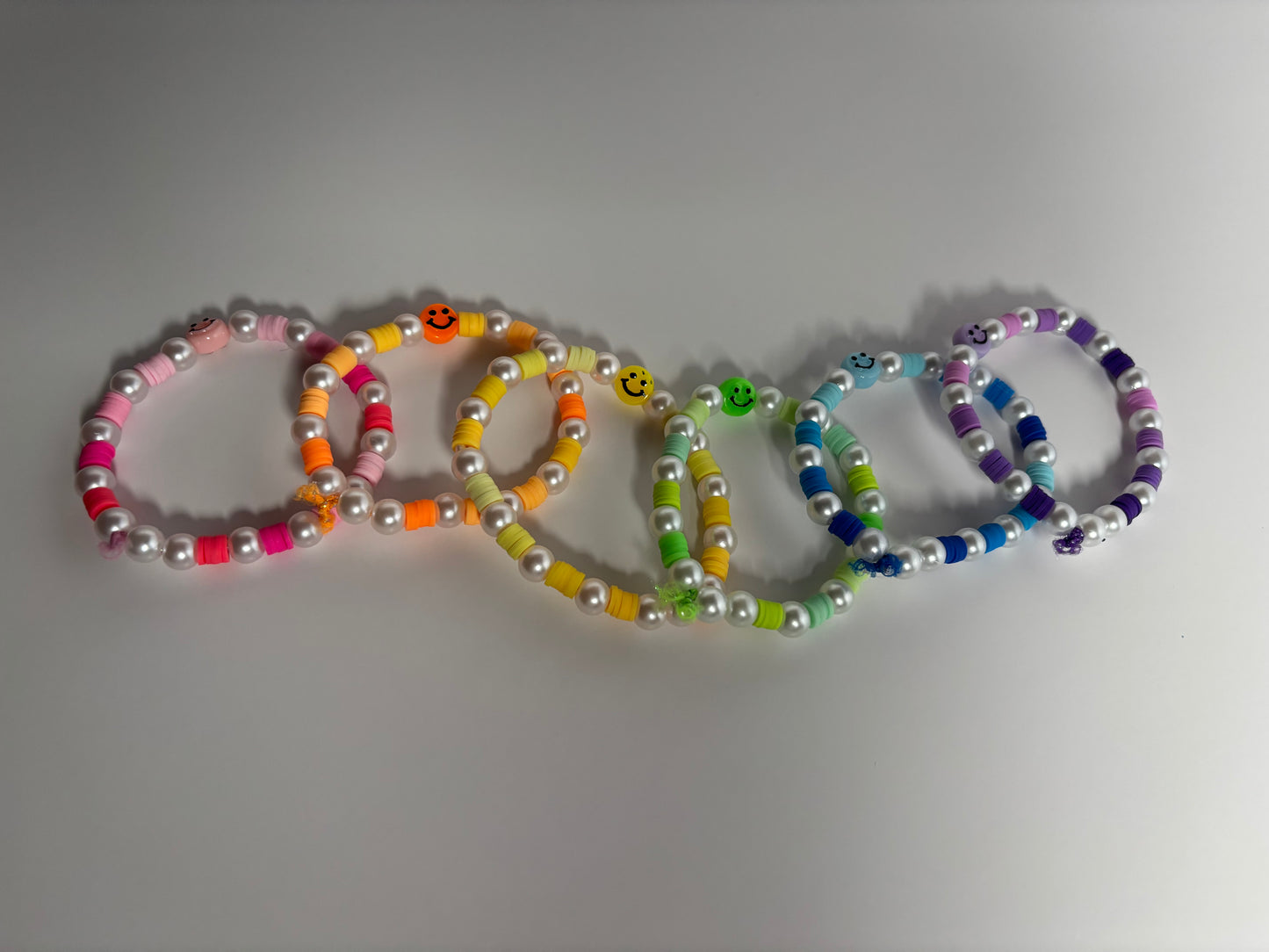 Smiley face, rainbow bracelets