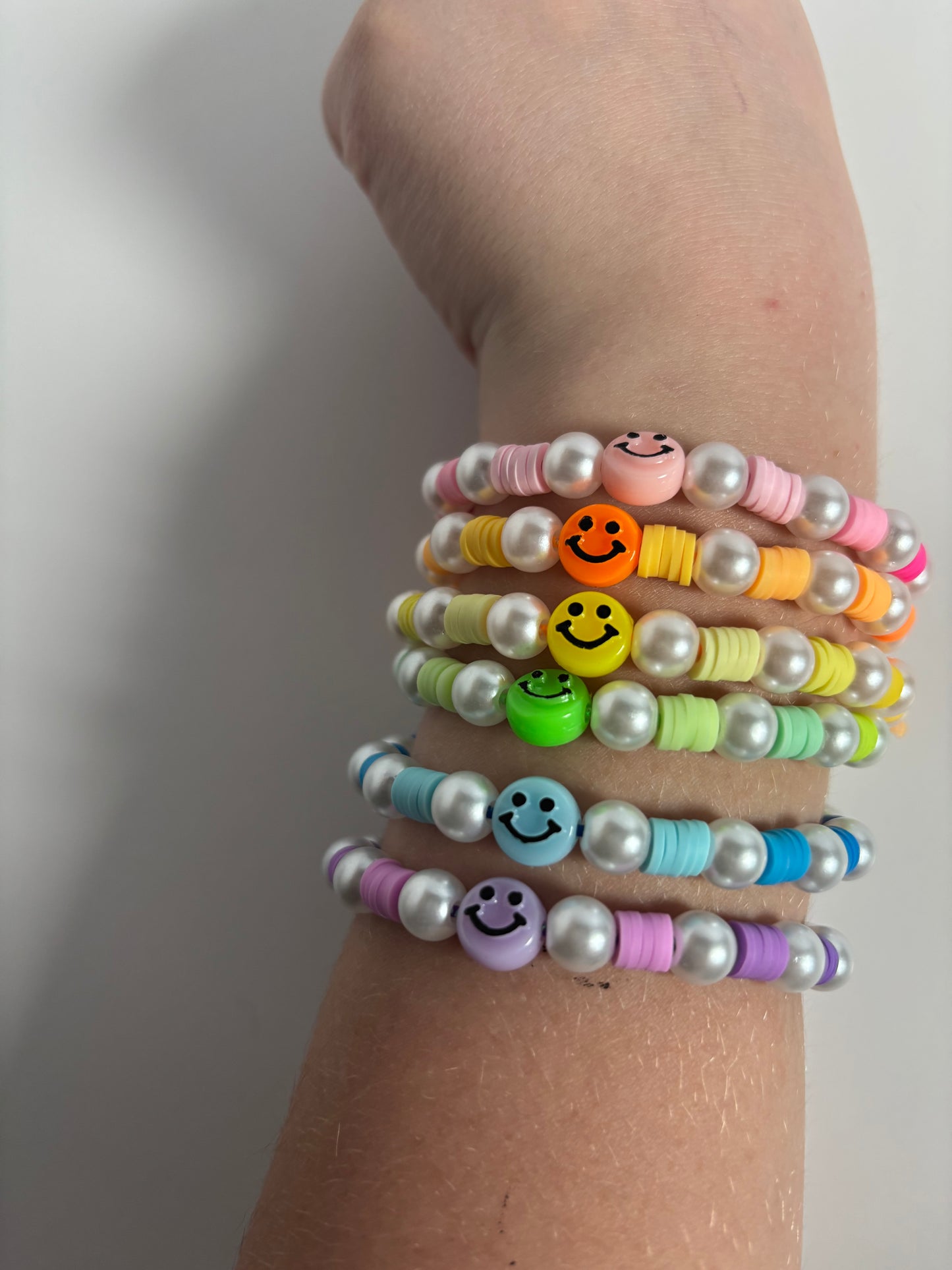 Smiley face, rainbow bracelets